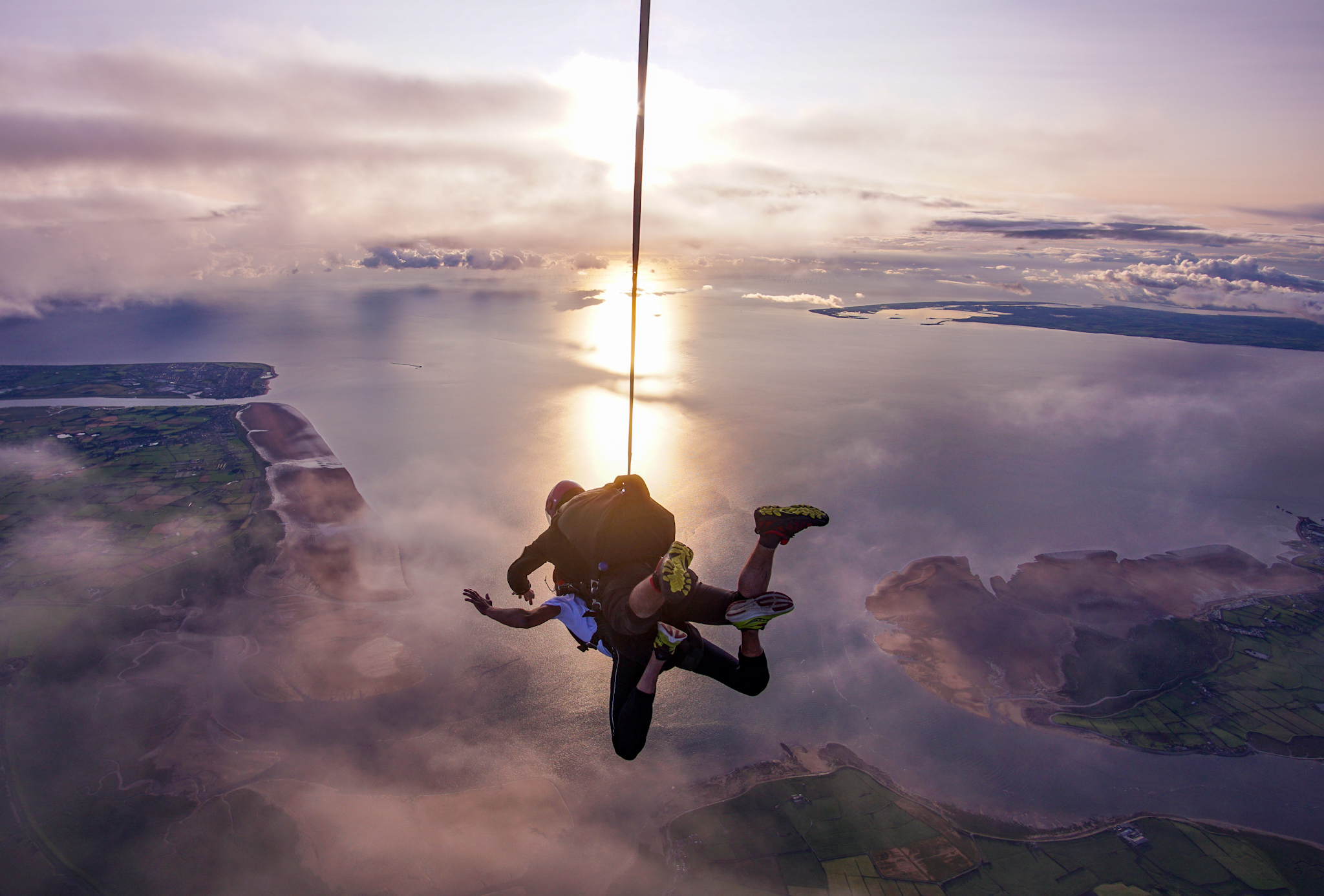 Tandem skydiving from an aircraft with instructor and jumper in freefall